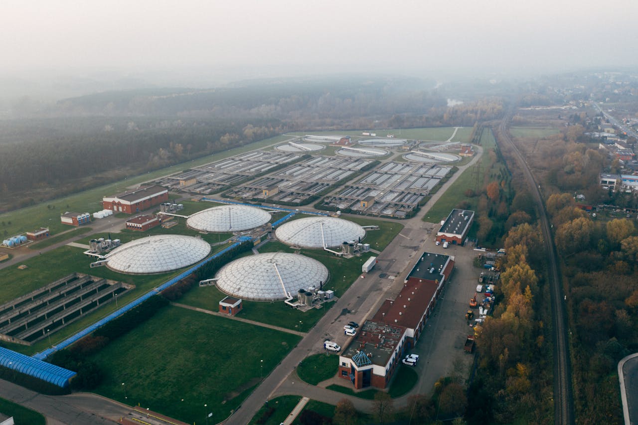 about-img Aerial shot of a wastewater treatment facility in PoznaĆ, showcasing industrial technology and environmental effort.